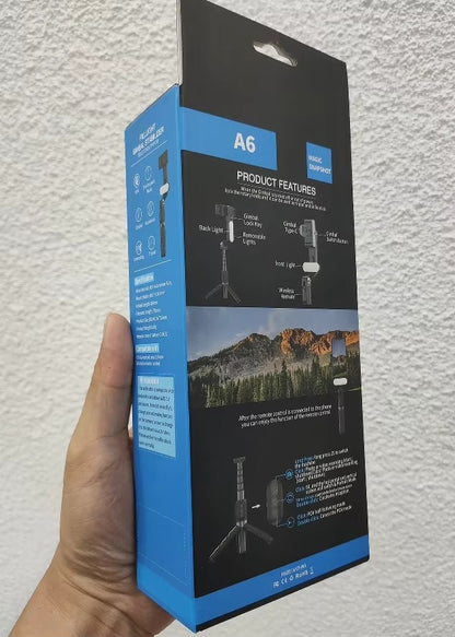 Hand holding a blue and black product packaging box labeled 'A6' against a light gray background.