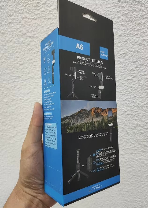 Hand holding a blue and black product packaging box labeled 'A6' against a light gray background.