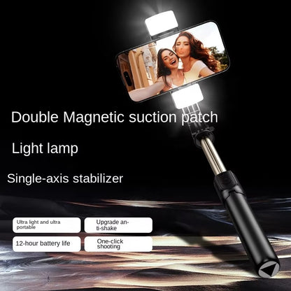 Smartphone selfie stick with light lamp and magnetic suction patch on a dark background